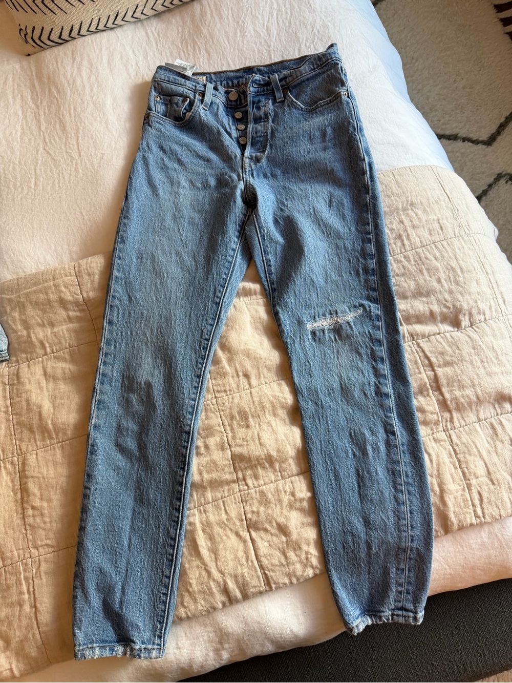 Levi's High-Rise Light Blue Button-Fly Jeans with Knee Distress